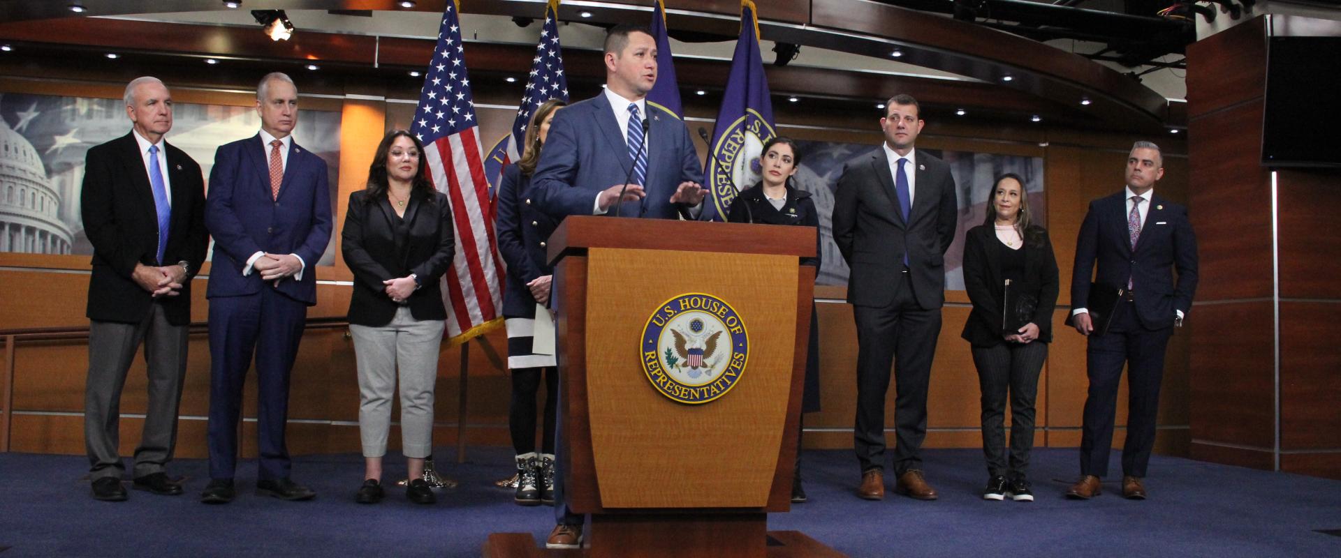 Speaking at a podium
